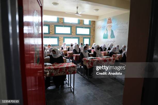 Afghan girls attend a class in a high school in Mazar-i-Sharif, Afghanistan on October 10, 2021. High school education continues for girls in only...