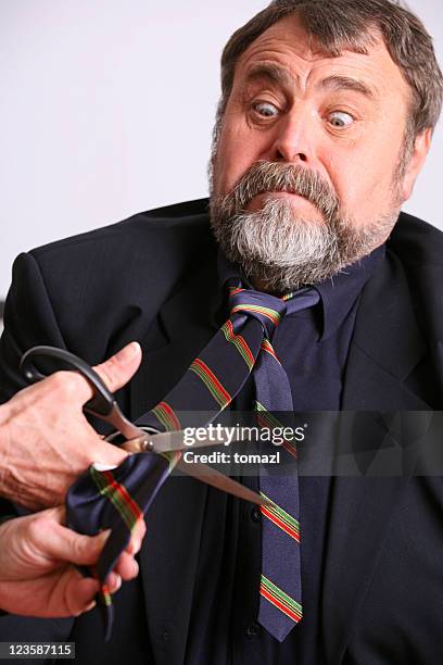 aggression against his tie - cutting ties stock pictures, royalty-free photos & images