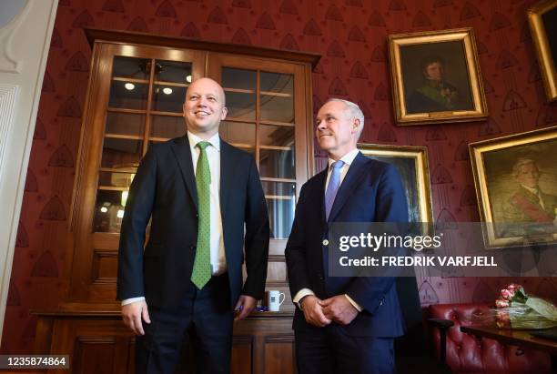 Norway's outgoing Minister of Finance Jan Tore Sanner and incoming Minister of Finance Trygve Slagsvold Vedum pose during the key handover ceremony...