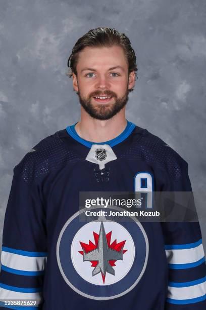 Josh Morrissey of the Winnipeg Jets poses for his official headshot for the 2021-2022 season on September 22, 2021 at the Bell MTS Iceplex in...