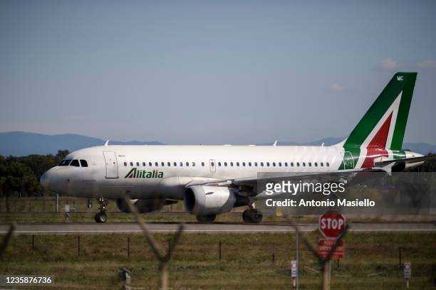 An Alitalia airplane taking off on the runway of the Fiumicino airport during the last day of Italian airline Alitalia operations, on October 14,...