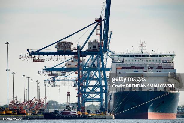Cargo ship is docked at the Port of Baltimore October 14 in Baltimore, Maryland. - Closed factories, clogged ports, no truck drivers -- up and down...