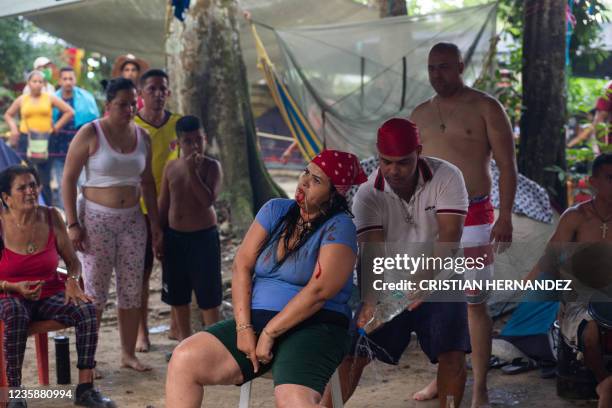 Woman performs a ritual to channel ancient spirits on the Sorte mountain, in Yaracuy state, Venezuela, on October 11, 2021. - On October, thousands...