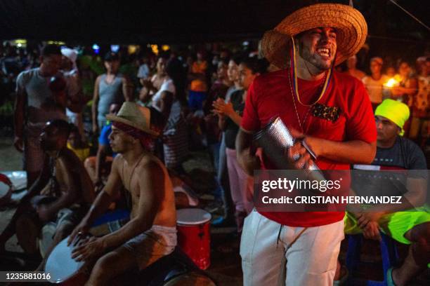 Graphic content / A man sings during a religious ceremony on the Sorte mountain, in Yaracuy state, Venezuela, on October 12, 2021. - On October,...