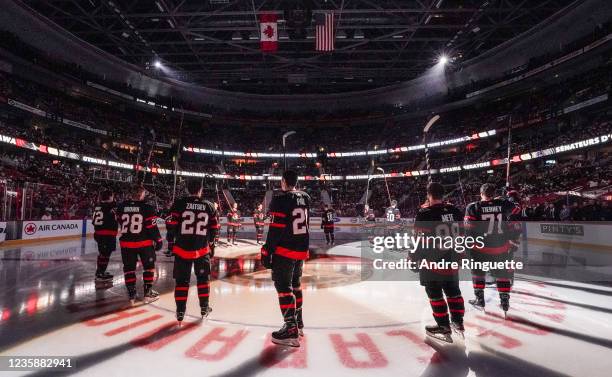 Connor Brown, Nikita Zaitsev, Nick Paul, Victor Mete and Chris Tierney of the Ottawa Senators salute the fans during player introductions prior to...