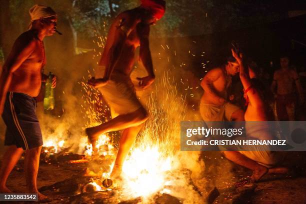 Graphic content / People take part in the "Baile de la Candela" religious ceremony on the Sorte mountain, in Yaracuy state, Venezuela, on October 12,...