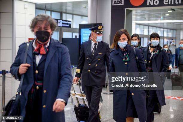 Alitalia workers arrive at Fiumicino airport on the last day of operations for the 74-year-old airline on October 14, 2021 in Rome, Italy. The last...