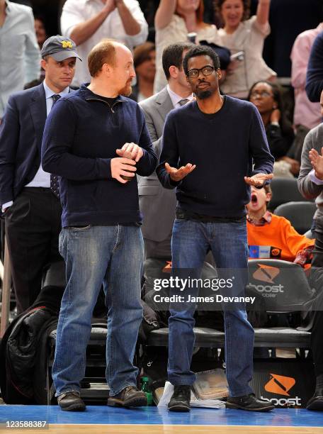 Louis C.K. And Chris Rock attend the Milwaukee Bucks vs New York Knicks game at Madison Square Garden on February 23, 2011 in New York City.