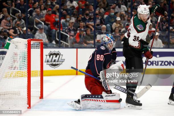 Elvis Merzlikins of the Columbus Blue Jackets stops a shot by Christian Fischer of the Arizona Coyotes during the third period at Nationwide Arena on...
