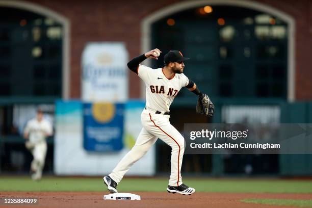 Tommy La Stella of the San Francisco Giants fields the ball in the first inning during Game 5 of the NLDS between the Los Angeles Dodgers and the San...