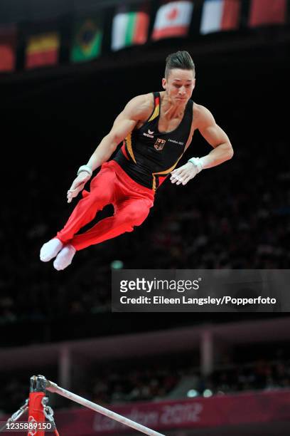 Marcel Nguyen representing Germany competing on horizontal bar in the mens artistic team all-around final during day 3 of the 2012 Summer Olympics at...