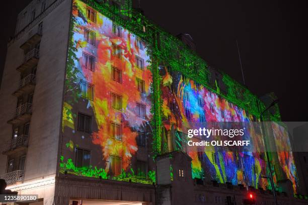 Spectators admire the artwork 'ARC' by British artists Greenaway and Greenaway projected onto the Queens Hotel during the annual 'Light Night Leeds'...