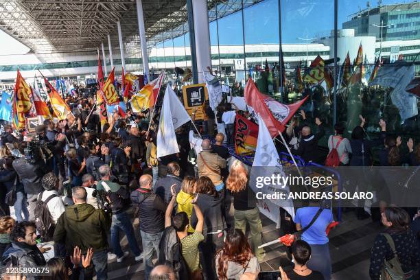 Employees of Italian airline Alitalia take part in a protest outside Terminal 1 of Rome's Fiumicino airport on October 15 as new Italian airline...