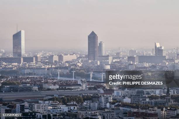 This general view shows a haze of pollution over Lyon, south-eastern France on October 15, 2021. - A crunch UN climate meeting which is scheduled to...