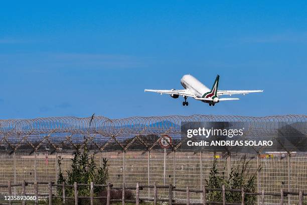 An airplane of new Italian airline company ITA, bearing the Alitalia livery after ITA retained Alitalia brand for 90 million euros, takes off from...