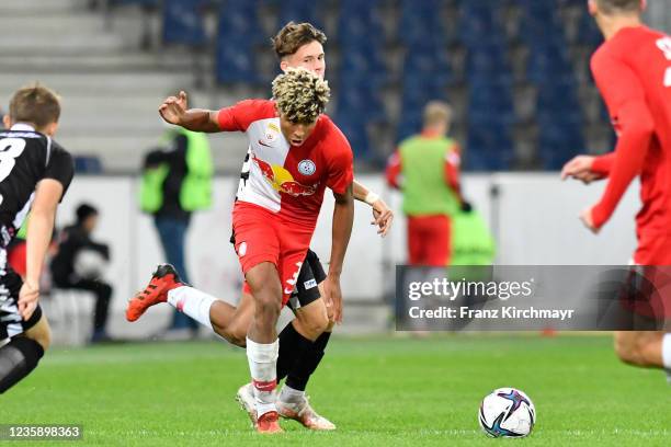 Justin Omoregie of Liefering and Eduard Josef Haas of Juniors OOe during the 2. Liga match between FC Liefering and FC Juniors OOe at Red Bull Arena...