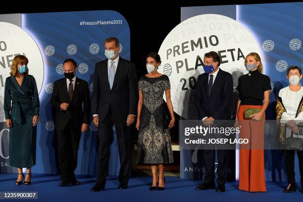 Spain's King Felipe VI , Spain's Queen Letizia and President of Grupo Planeta Jose Creuheras pose for pictures as they arrive for the 70th edition of...