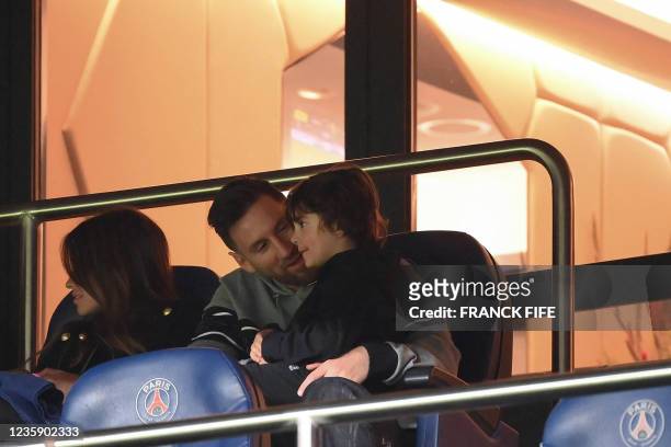 Paris Saint-Germain's Argentinian forward Lionel Messi and his son attend the French L1 football match between Paris Saint-Germain and SCO Angers at...