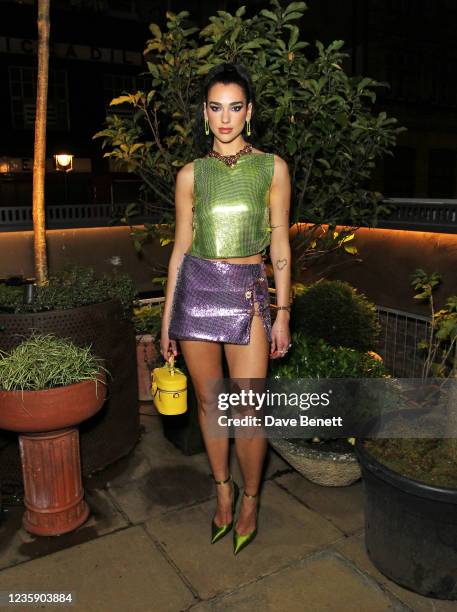 Dua Lipa attends an exclusive party hosted by Frieze and Versace to celebrate London's creative community at Toklas on October 15, 2021 in London,...