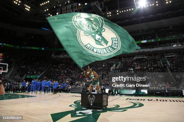Bango the Milwaukee Bucks mascot waves the flag before the game against the Dallas Mavericks on October 15, 2021 at the Fiserv Forum Center in...
