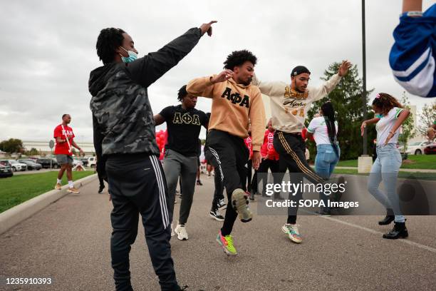 Members of Alpha Phi Alpha fraternity dance during the Indiana University Homecoming Parade. Student Groups participate in the Indiana University...