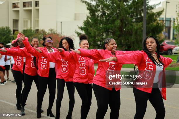 Members of Delta Sigma Theta sorority dance during the Indiana University Homecoming Parade. Student Groups participate in the Indiana University...