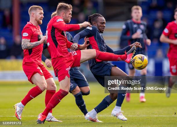 Ross County's Regan Charles-Cook competes with Marcus Fraser during a cinch Premiership match between Ross County and St Mirren at the Global Energy...