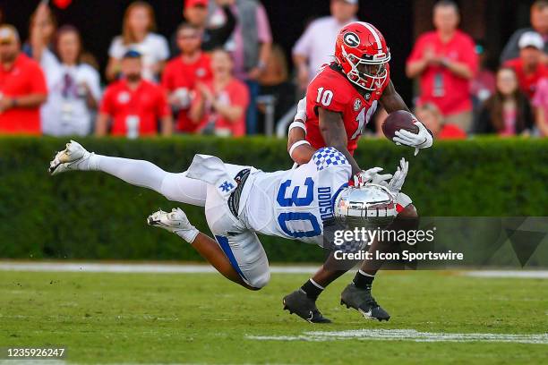 Kentucky defensive back Taj Dodson attempts to tackle Georgia wide receiver Kearis Jackson during the college football game between the Kentucky...