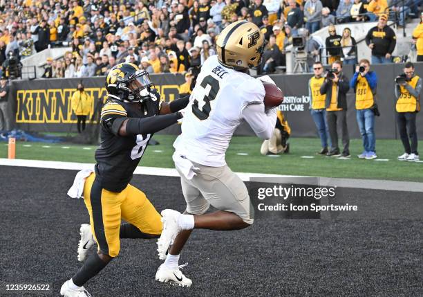 Purdue wide receiver David Bell catches a touchdown pass as Iowa defensive end Matt Hankins defends during a college football game between the Purdue...