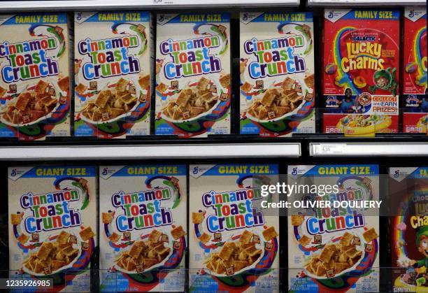 General Mills' Cinnamon Toast Crunch 18.8-ounce and 20-ounce boxes are on display on a supermarket shelf on October 15 in Arlington, Virginia. - More...