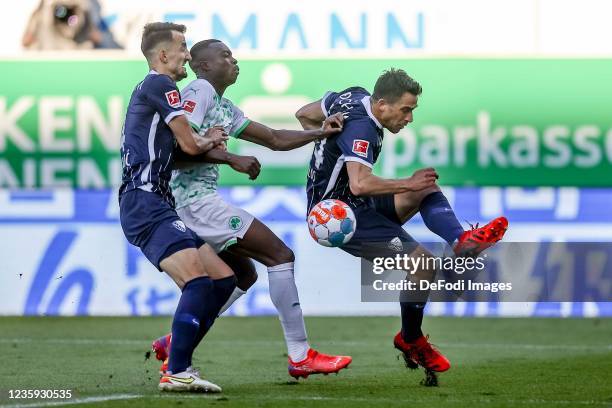 Erhan Masovic of VfL Bochum, Dickson Abiama of SpVgg Greuther Fuerth and Vasilios Lampropoulos of VfL Bochum battle for the ball during the...