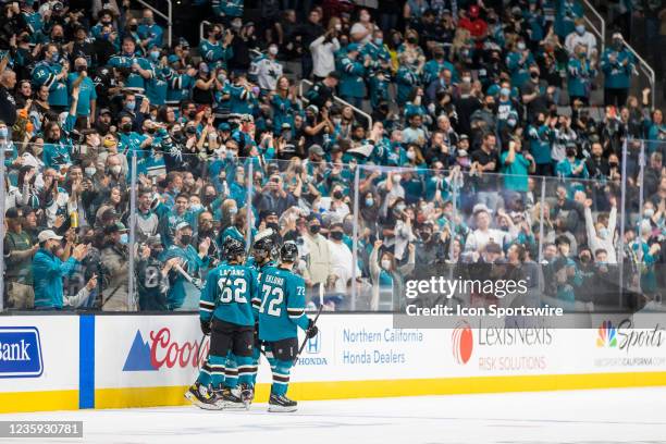 Sharks players celebrate their goal in front of the home crowd during the NHL pro hockey game between the Winnipeg Jets and San Jose Sharks on...