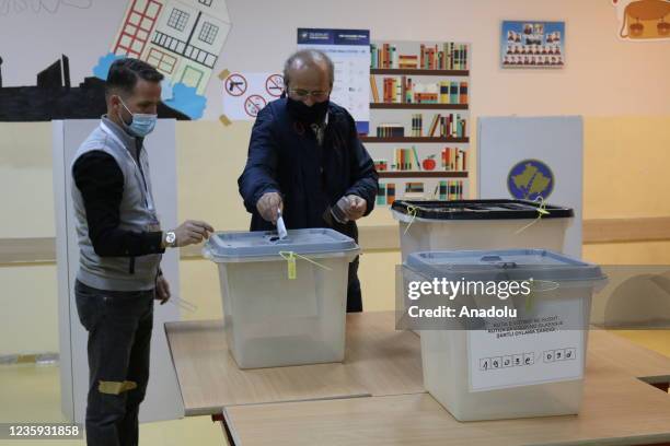 Kosovans cast their votes to elect their municipal representatives at a polling station on October 17, 2021 in Pristina, Kosovo.