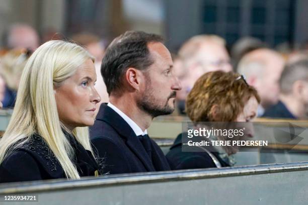 Crown Princess Mette-Marit of Norway, Crown Prince Haakon of Norway and Mayor of Kongsberg, Kari Anne Sand, sit in the Kongsberg church in Kongsberg,...