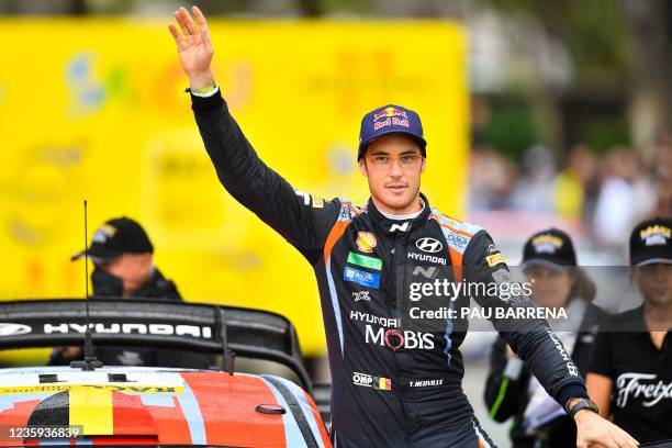 Hyundai Shell Mobis World Rally's driver Thierry Neuville of Belgium, competing with a Hyundai i20 Coupe WRC, waves as he celebrates his victory...