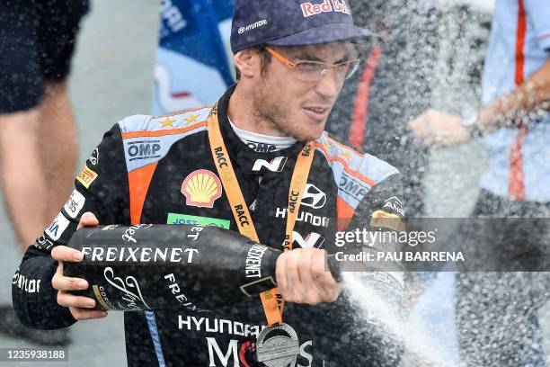 Belgium's driver Thierry Neuville of Hyundai Shell Mobis World Rally, celebrates with champagne on the podium after winning the Catalonia 2021 FIA...