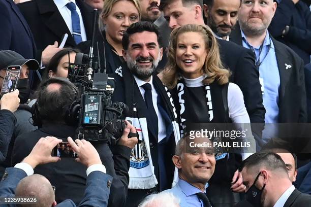Newcastle United's Saudi Arabian chairman Yasir Al-Rumayyan and Newcastle United's English minority owner Amanda Staveley take their seats for the...
