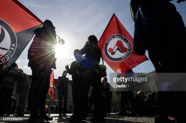 Counter-demonstrators protest against a rally of the German right-wing movement PEGIDA in Dresden, eastern Germany on October 17 marking its 7th...
