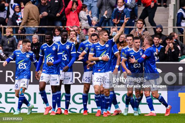 Ludovic Ajorque of RC Strasbourg celebrating his goal with his teammates during the Ligue 1 Uber Eats match between RC Strasbourg and AS...