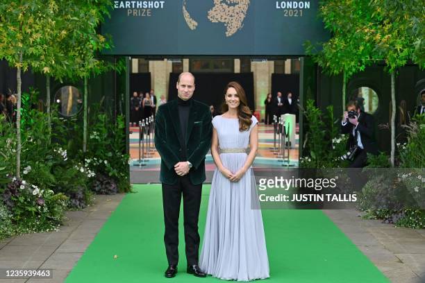 Britain's Prince William, Duke of Cambridge, and Britain's Catherine, Duchess of Cambridge, arrive on the green carpet to attend the inaugural...