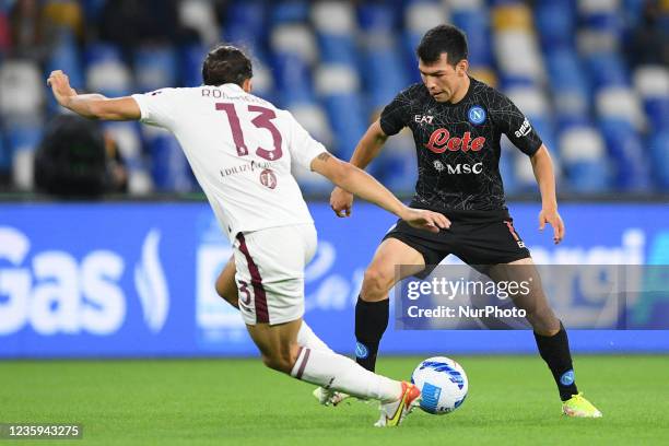 Hirving Lozano of SSC Napoli and Ricardo Rodriguez of FC Torino compete for the ball during the Serie A match between SSC Napoli and FC Torino at...