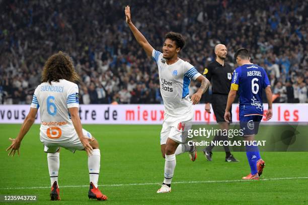 Marseille's French defender Boubacar Kamara celebrates scoring his team's first goal with Marseille's French defender Matteo Guendouzi during the...