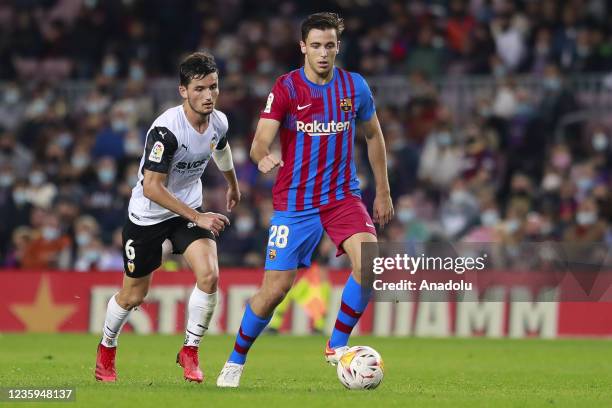 Barcelona's midfielder Gabi vies with Valencia's defender Hugo Duro during the Spanish league football match between FC Barcelona and Valencia CF at...