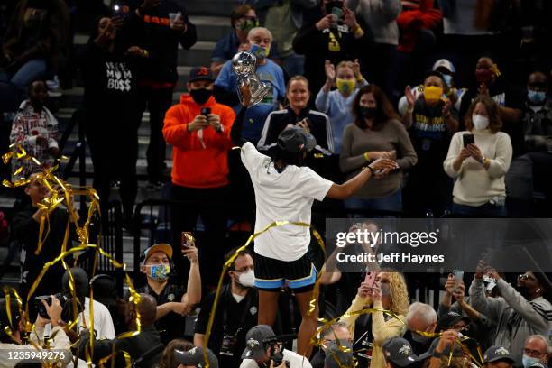 Diamond DeShields of the Chicago Sky holds up the trophy after winning Game Four of the 2021 WNBA Finals against the Phoenix Mercury on October 17,...