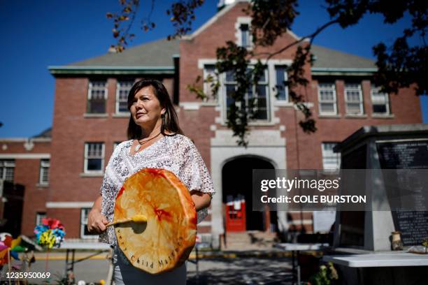 Kukpi7 Chief, Rosanne Casimir, of Tk'emlúps te Secwépemc poses at the site of a makeshift memorial at the former Kamloops Indian Residential School...