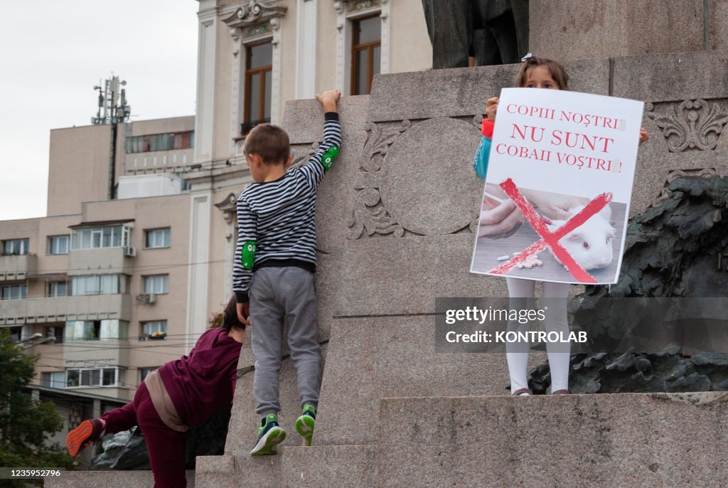 Some children play, during a demonstration in Iasi against...
