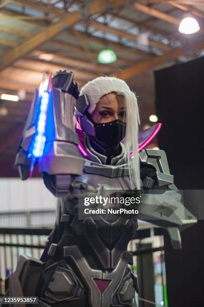 League of Legends fan poses for a photo using a costume inspired by a game character during the fourth day of the SOFA 2021, a fair aimed to the geek...