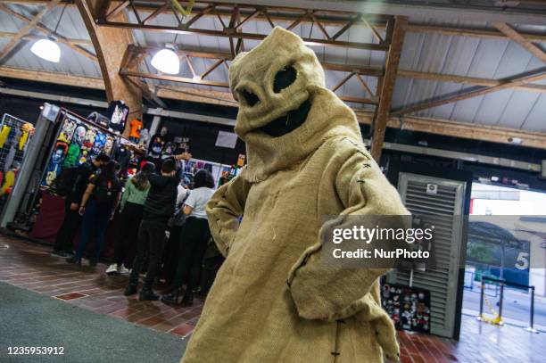 Fan of The Nightmare Before Christmas movie wears and poses for a photo with a costume of Oogie Boogie during the fourth day of the SOFA 2021, a fair...