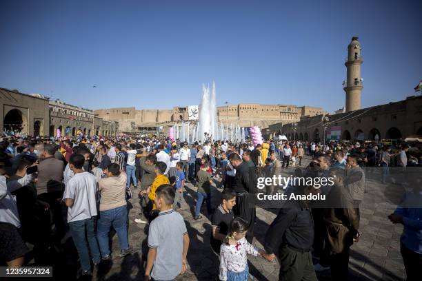 People gather around the Citadel of Erbil for the celebrations for Mawlid al-Nabi, the birth anniversary of Muslims' beloved Prophet Mohammad, in...