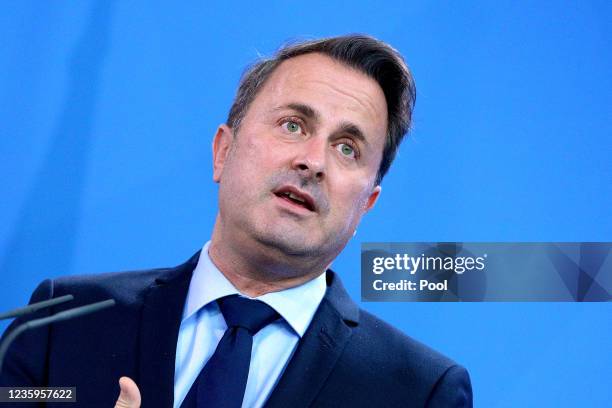 Prime Minister of Luxembourg Xavier Bettel attends a press conference with German Chancellor Angela Merkel after talks on October 18, 2021 in Berlin,...